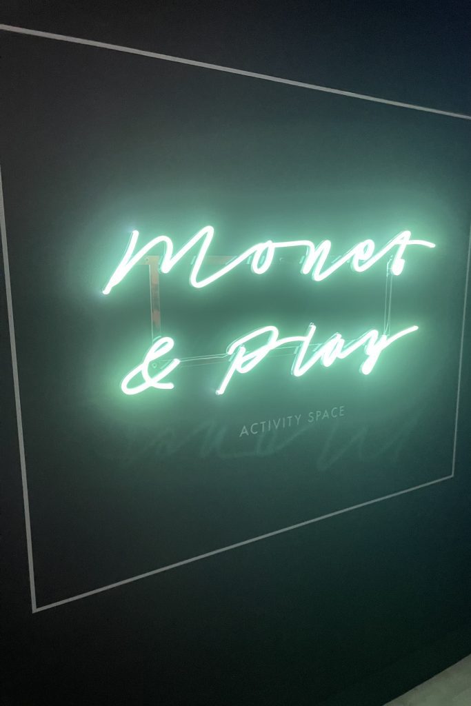 monet and play neon sign